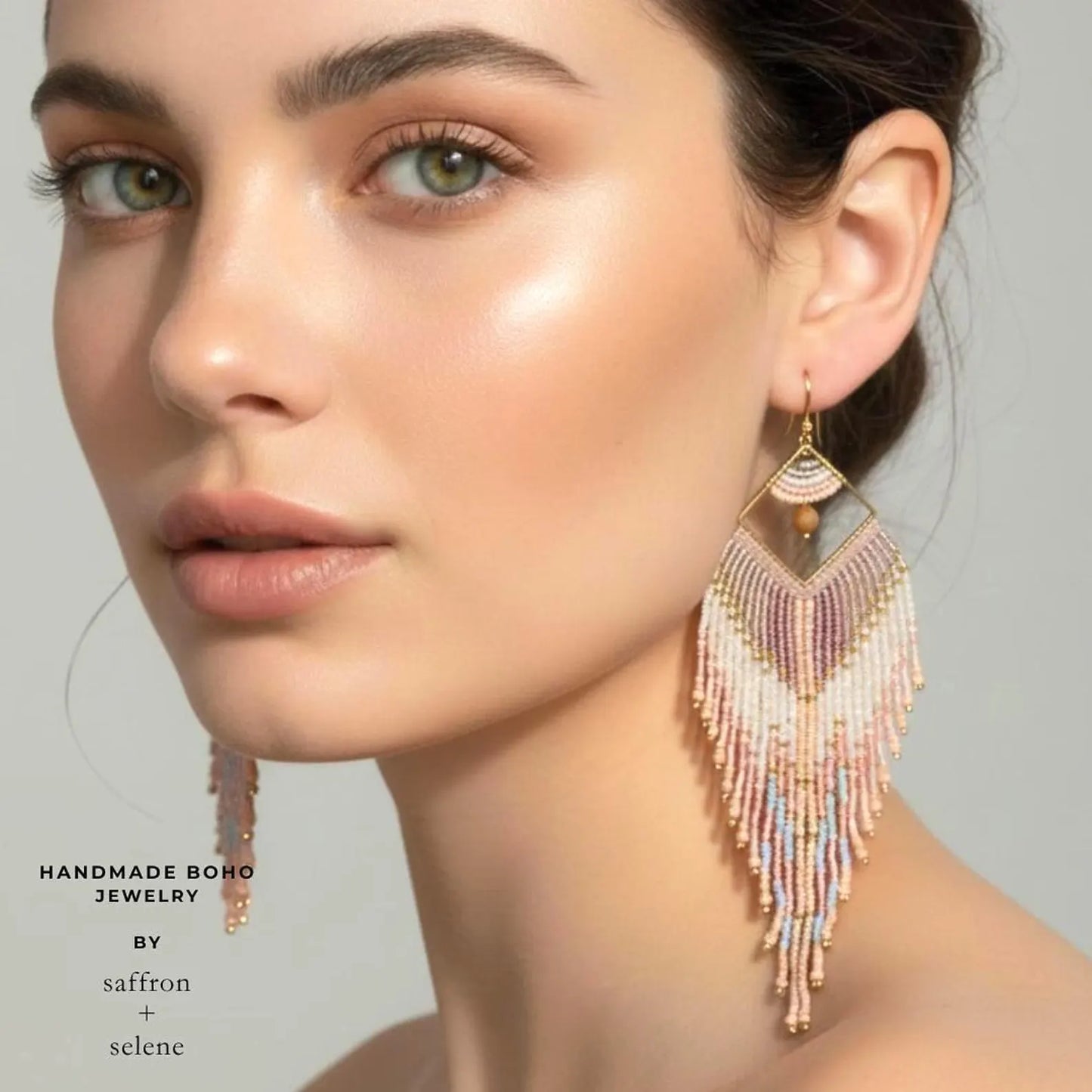 Handmade fringe earrings by Saffron and Selene in shades of pastel, long feather style