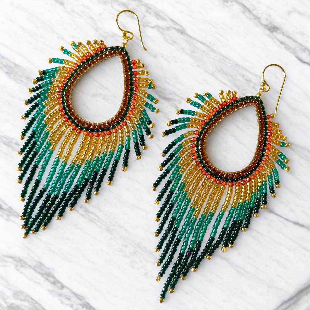 Fringe beaded earrings in a peacock feather style with shimmering irridecent fall colours on a gold plated teardrop frame.  Evening or festive earrings and fabulous unique one of a kind gift