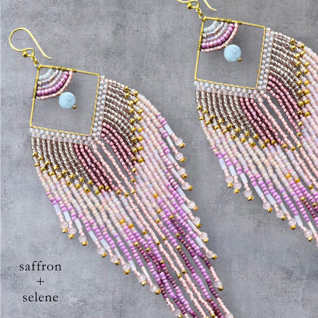 Handmade artisan earrings featuring blush pink mauve and metallic gold beads
