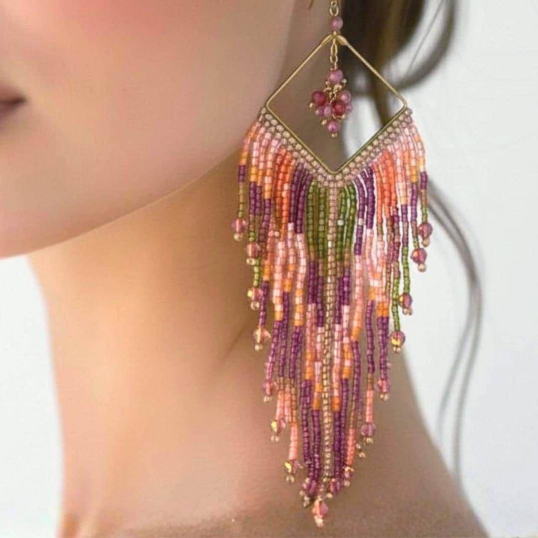 Long boho earrings with vibrant pink beadwork and artisan craftsmanship