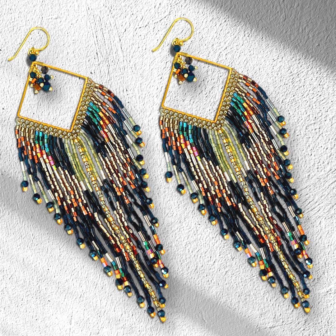 Handmade artisan earrings with shimmering metallic fringe
