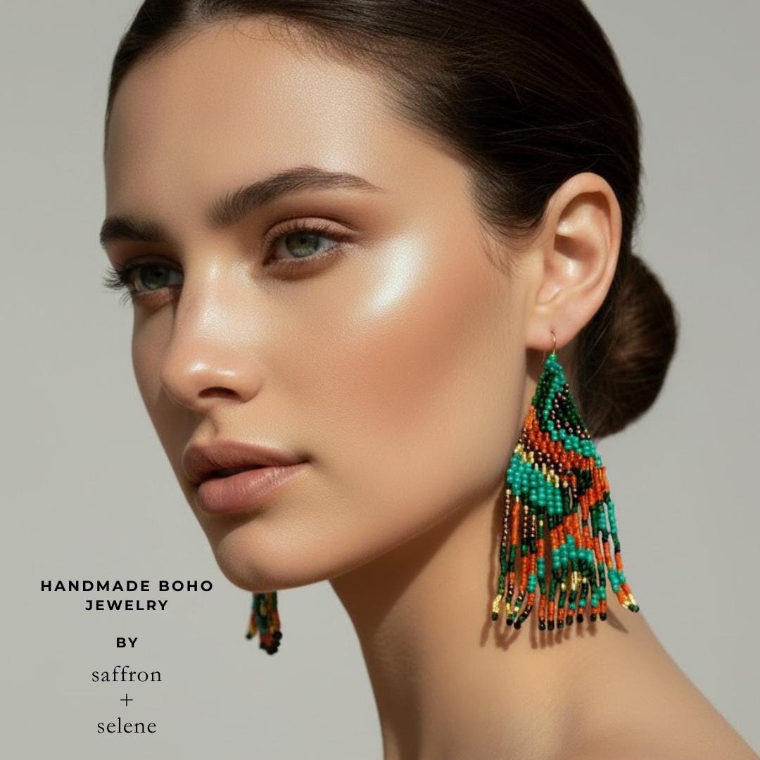 Boho statement earrings featuring long beaded fringe in earth tone colours and geometric design