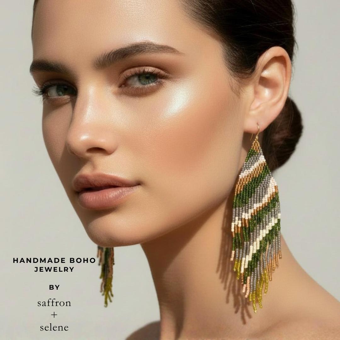 Green beaded fringe earrings styled on model showing length and movement