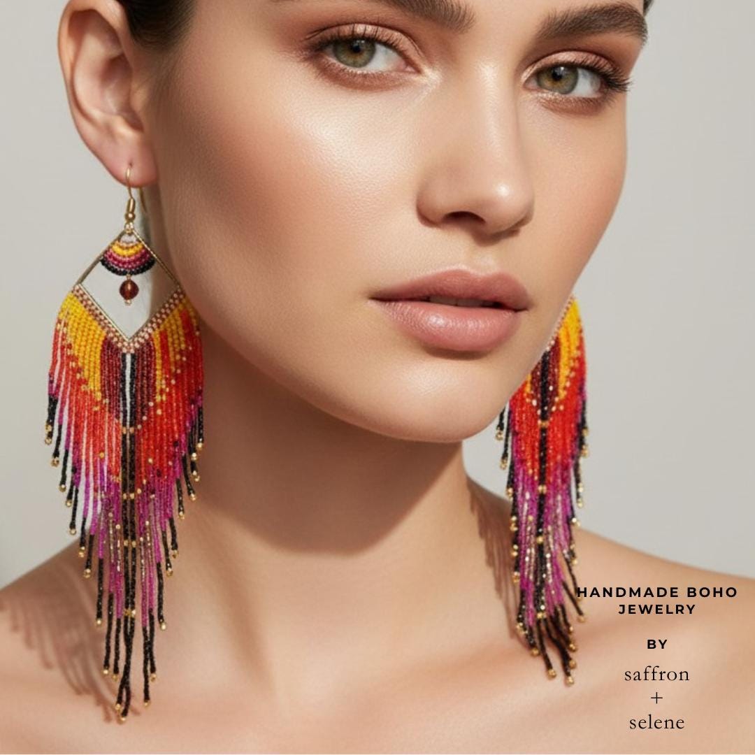 Boho seed bead earrings featuring flowing fringe and vibrant sunset inspired colours