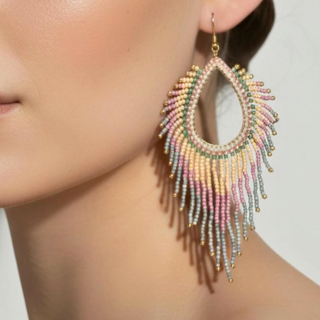 Handmade blush pink fringe earrings with jade bead detail