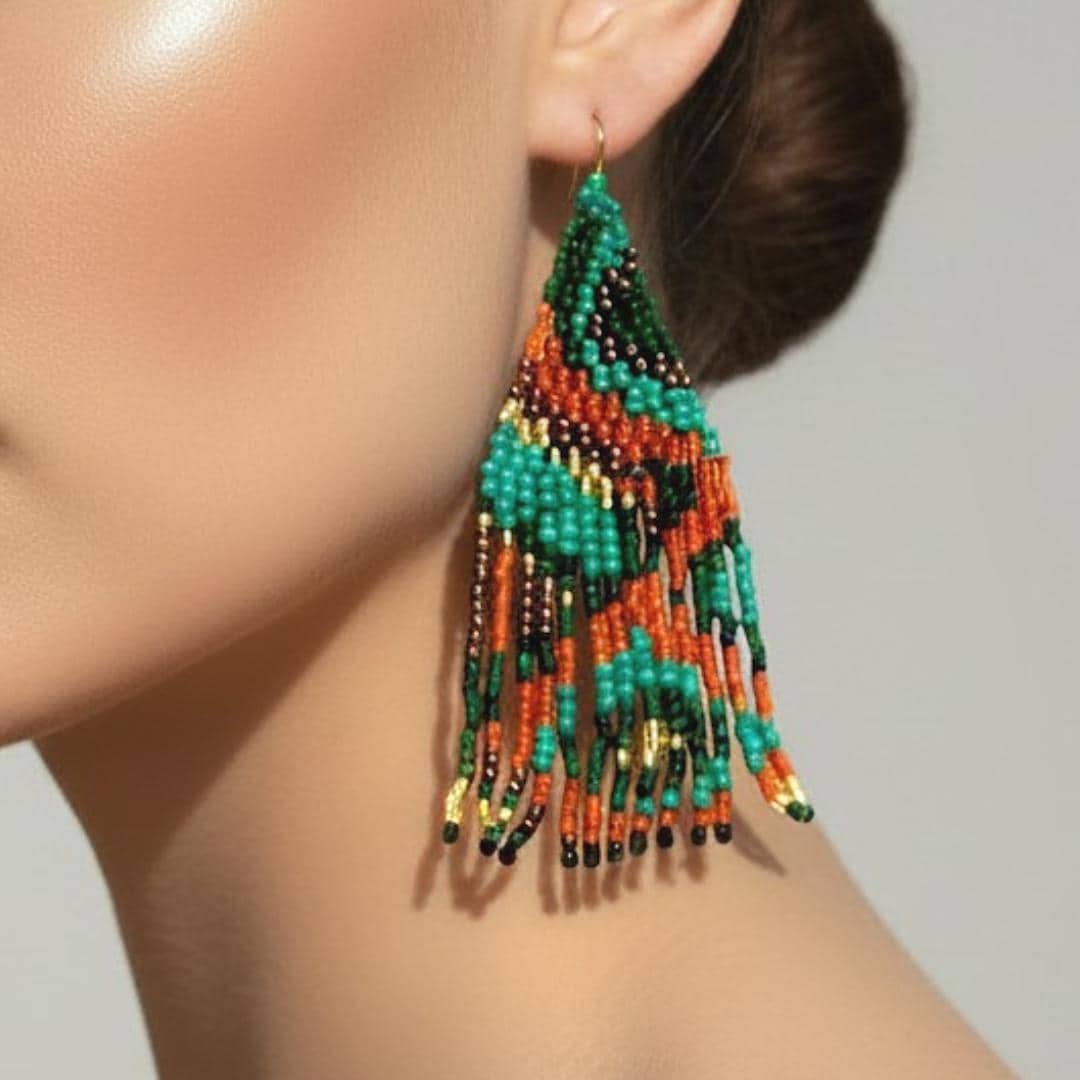 Handmade beaded fringe earrings in forest green, burnt orange, black and metallic gold with intricate artisan beadwork by Meg at Saffron and Selene