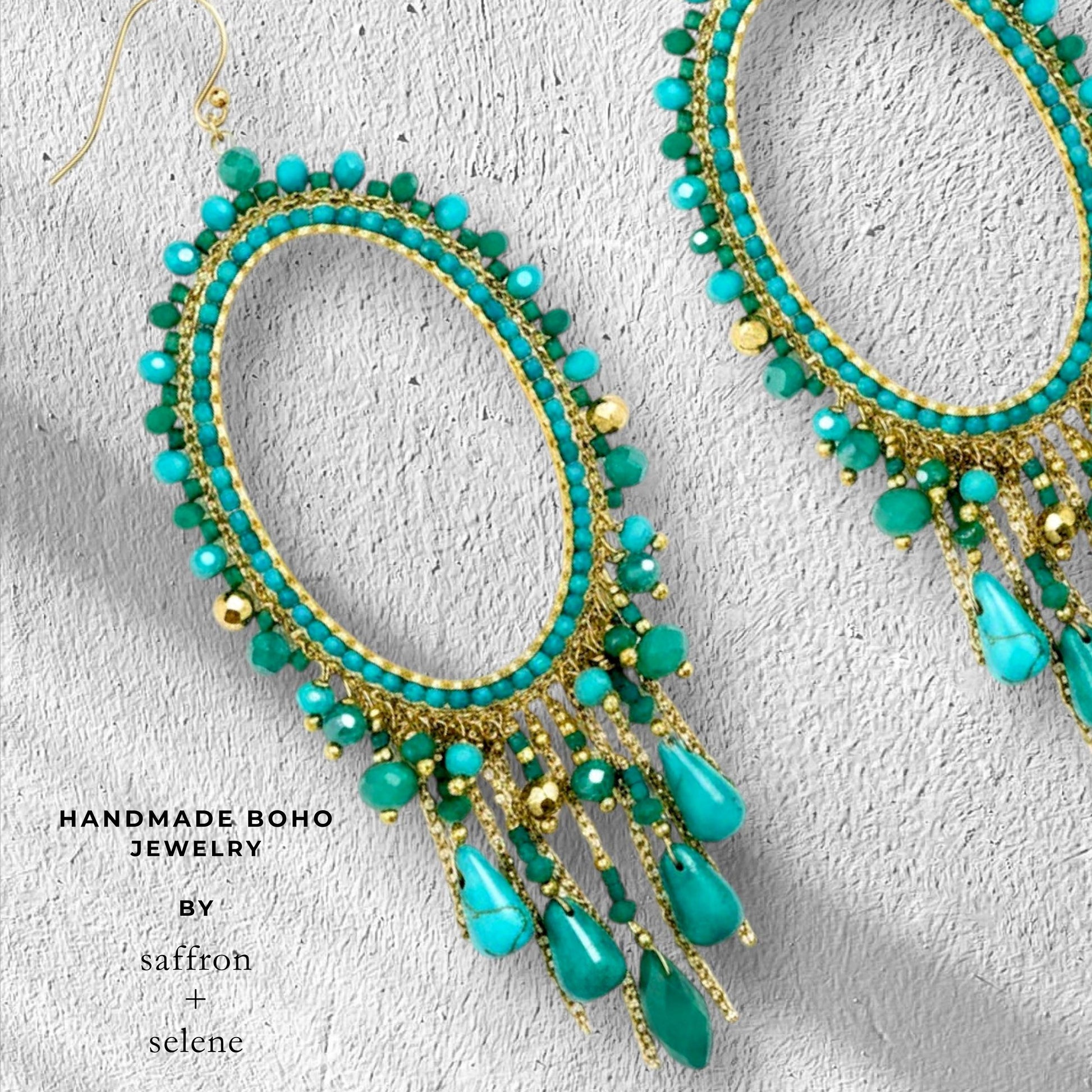 Boho turquoise statement earrings featuring gold chain tassels and jade green beads.