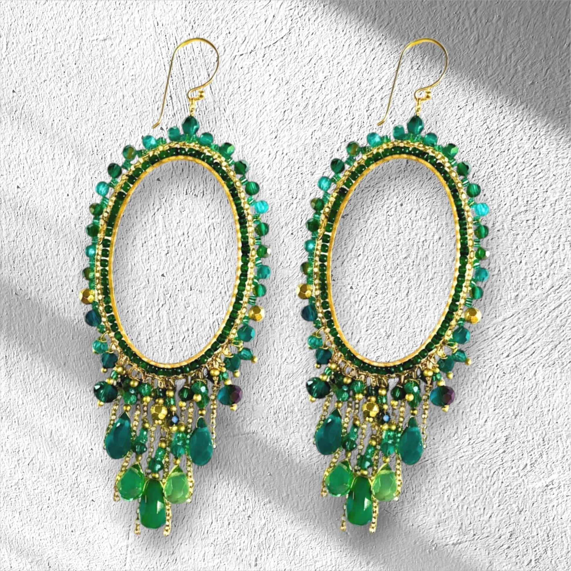 Emerald green beaded dangling earrings, chandelier style.  Accented with Jade Green, Chartruese and teal beads and brushed metalic gold detailing.  Handmade by Saffron and Selene boho jewelry for women