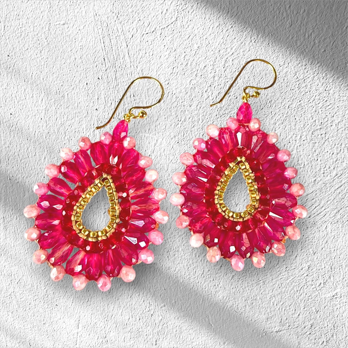 Handmade pink crystal statement earrings with gold teardrop centre and blush pale pink faceted beads