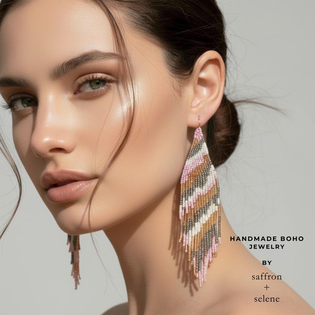 Boho statement earrings featuring flowing fringe in lilac champagne blush cream and metallic silver.
