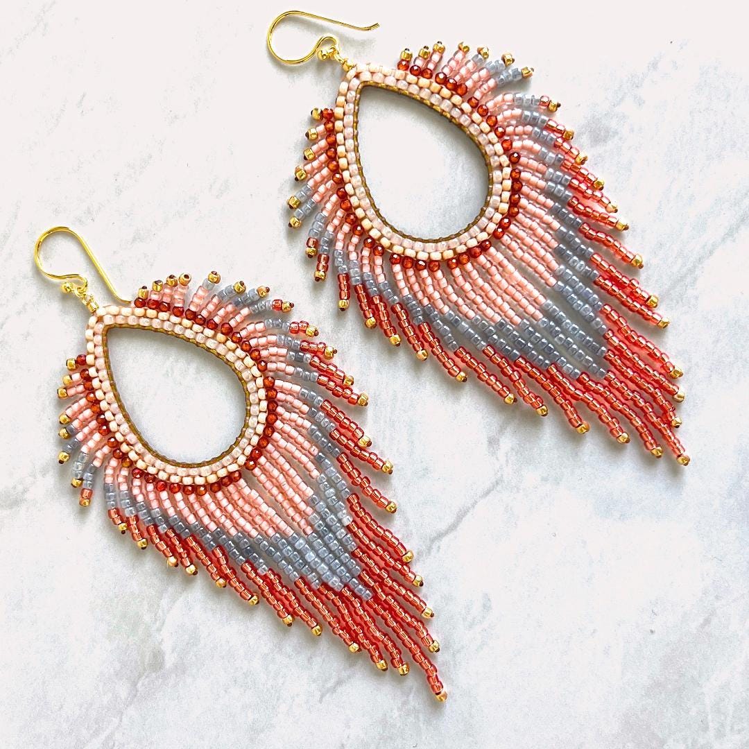 Pastel boho fringe earrings handmade with peach blue and rose gold glass seed beads.