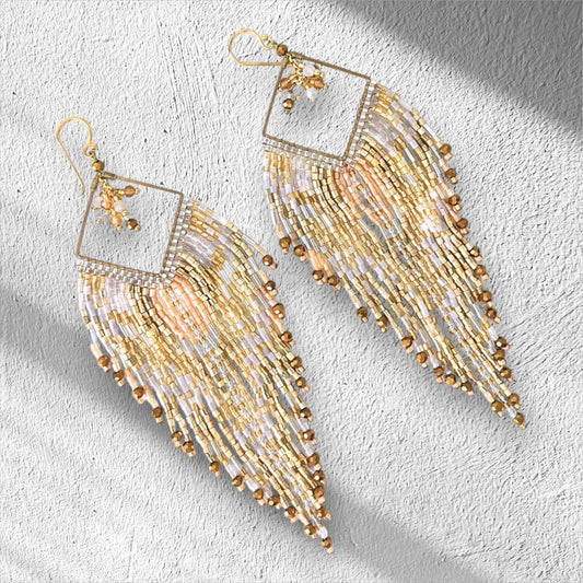 Champagne gold handmade fringe earrings with ivory beadwork and metallic gold details.