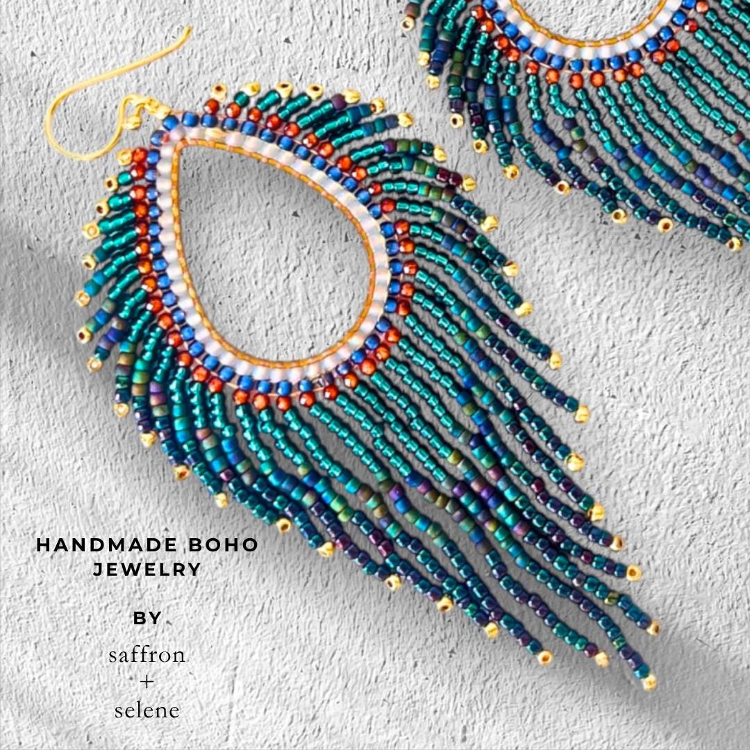 Luxury beaded statement fringe earrings in teal, blue and emerald green.