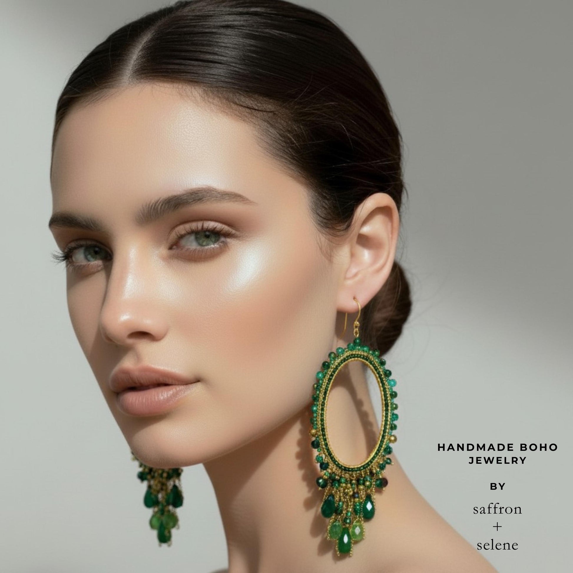 Green crystal chandelier drop earrings.  Long statement dangles in shades of green beads off a brushed metalic gold hoop.  Handmade by Saffron and Selene Boho Jewelry for Women