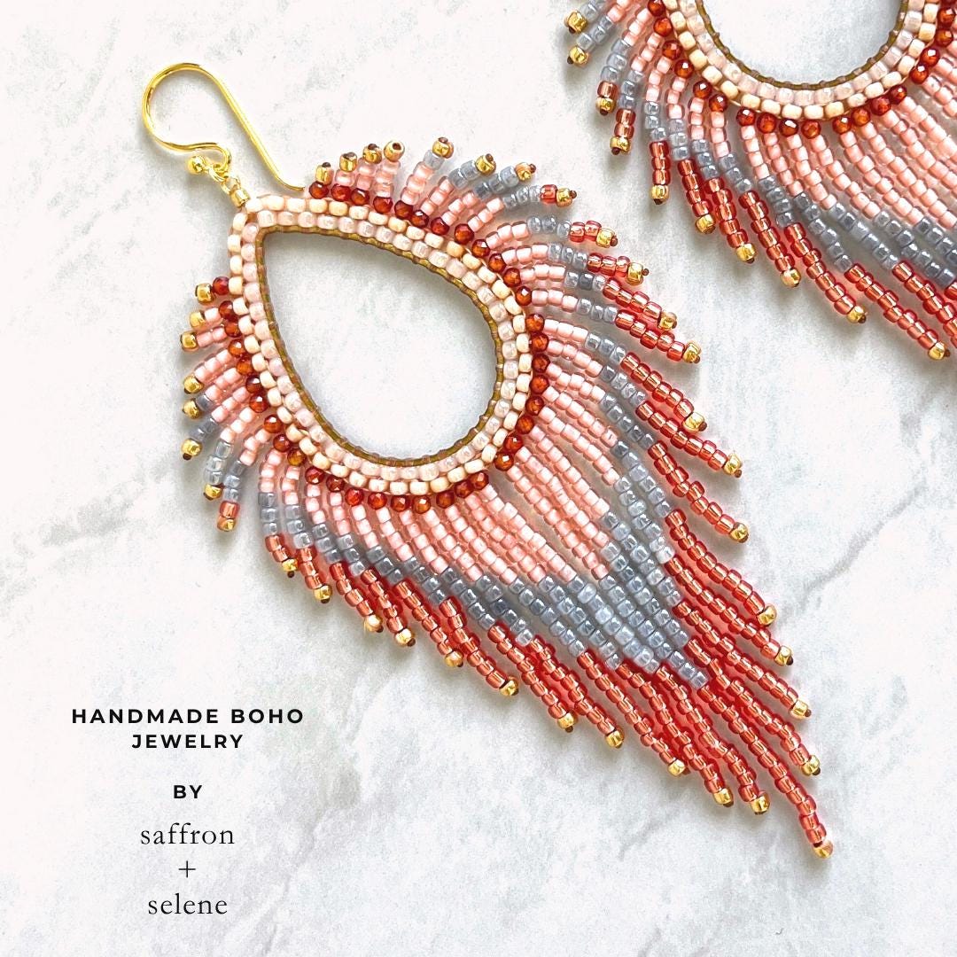 Handmade statement fringe earrings featuring shimmering pastel glass bead fringe.