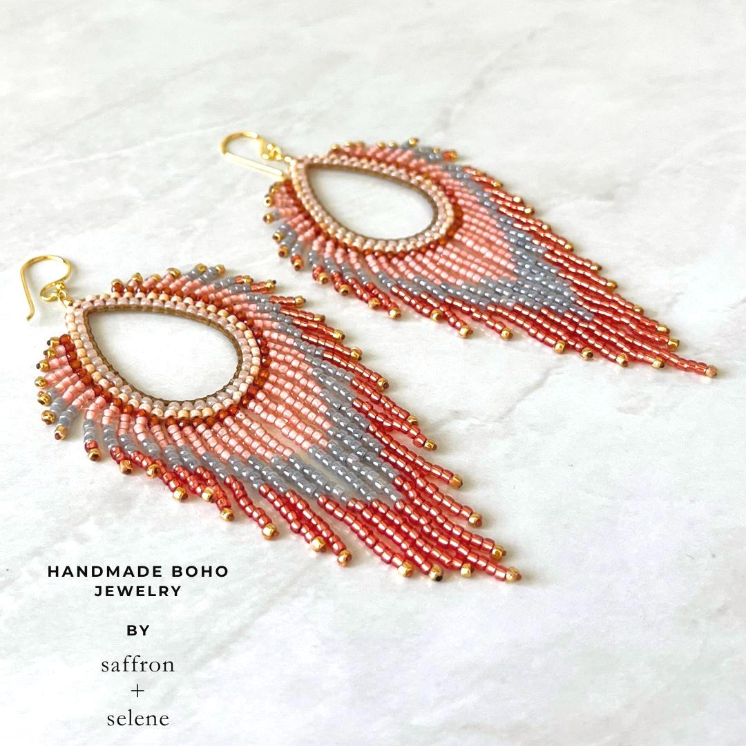Boho festival earrings with peach apricot blue and iridescent glass beads.
