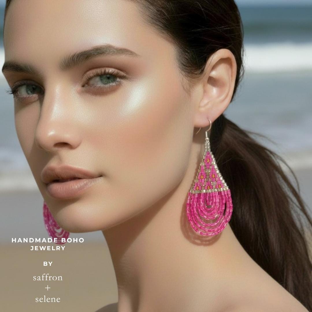 Modern pink artisan earrings featuring handwoven glass bead construction.