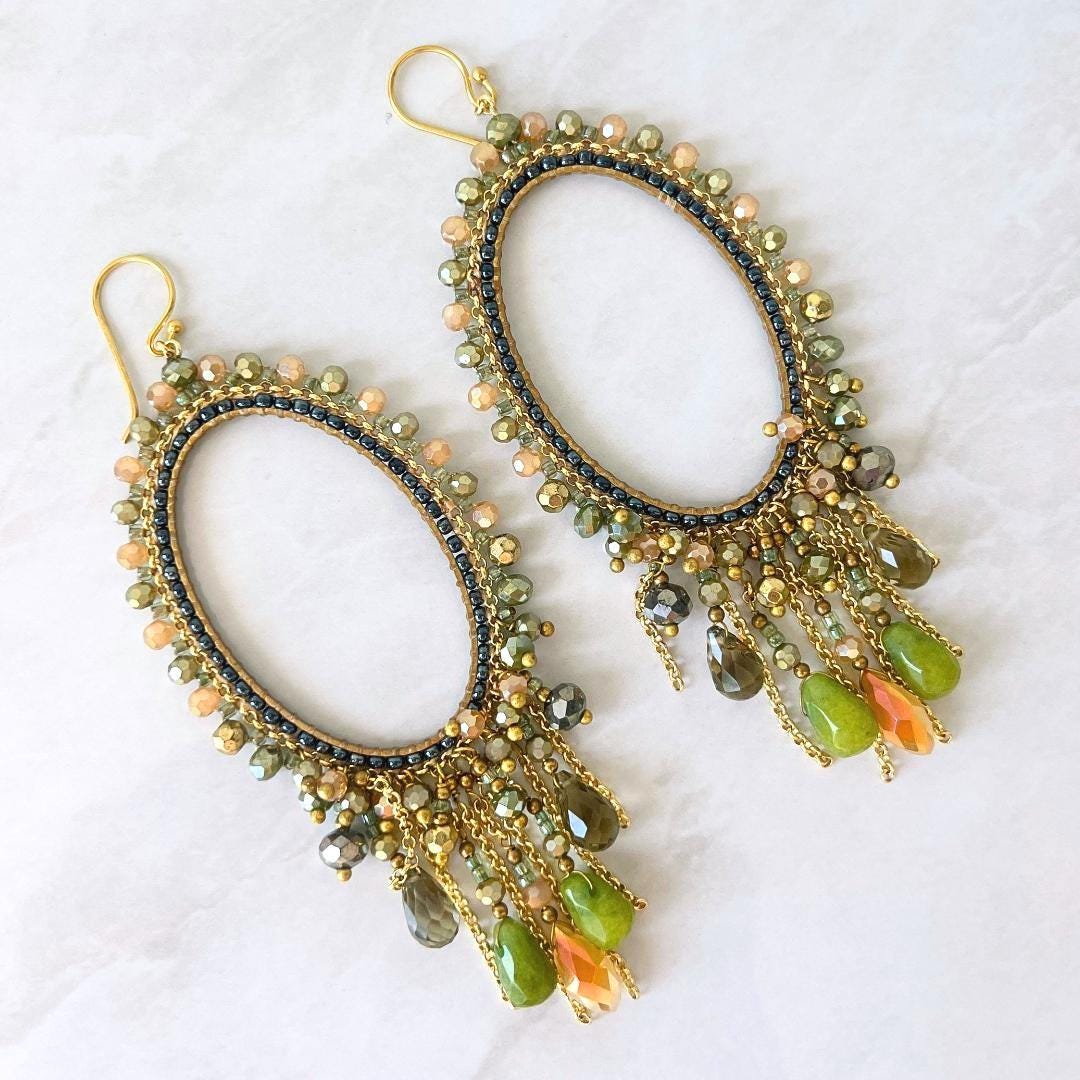 Olive green statement earrings featuring handwoven Japanese glass beads and gold chain fringe.