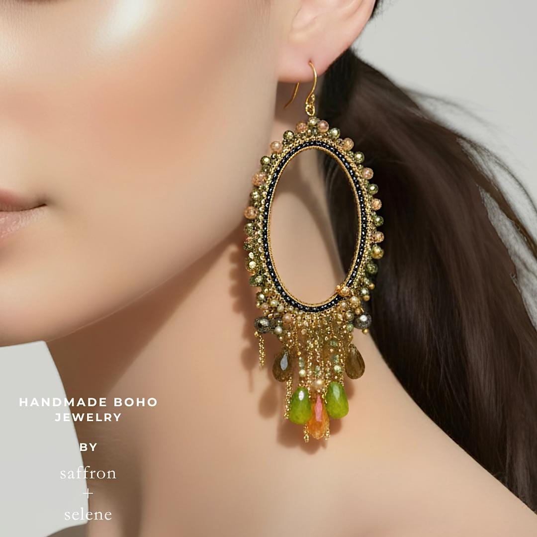 Gold oval drop earrings handcrafted with olive green crystals and premium seed beads.
