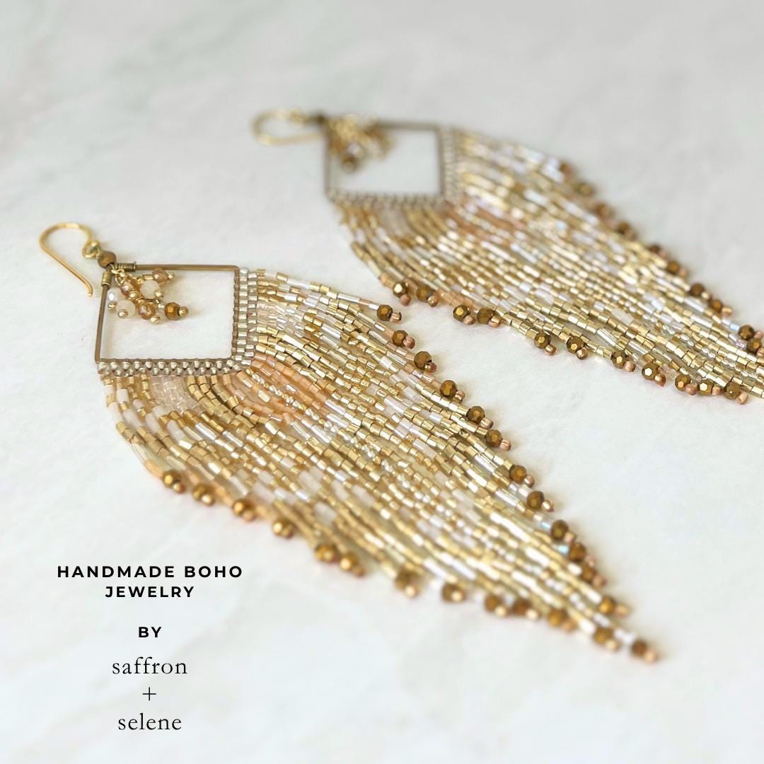 Luxury champagne beaded fringe earrings handcrafted with shimmering gold glass beads.