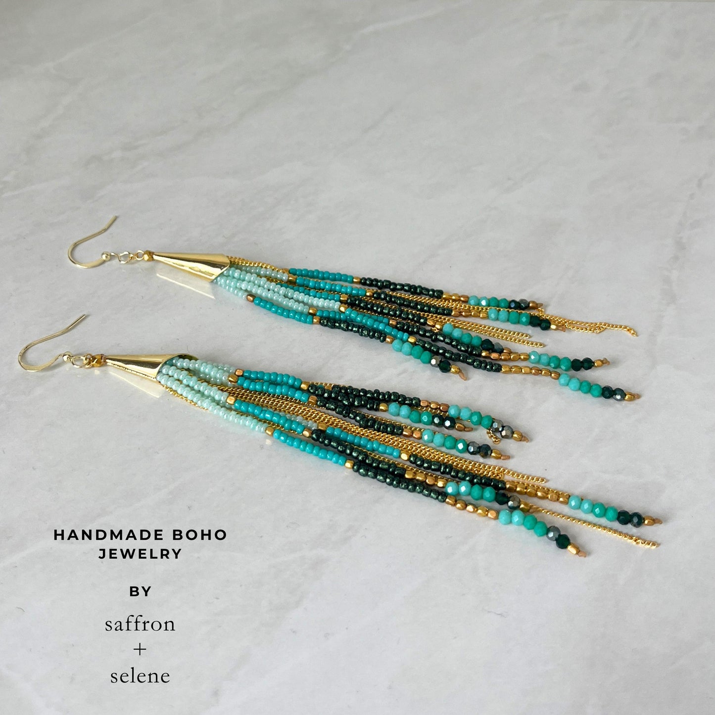 Luxury boho fringe earrings handmade with Japanese Miyuki seed beads in turquoise and green with shimmering gold details.