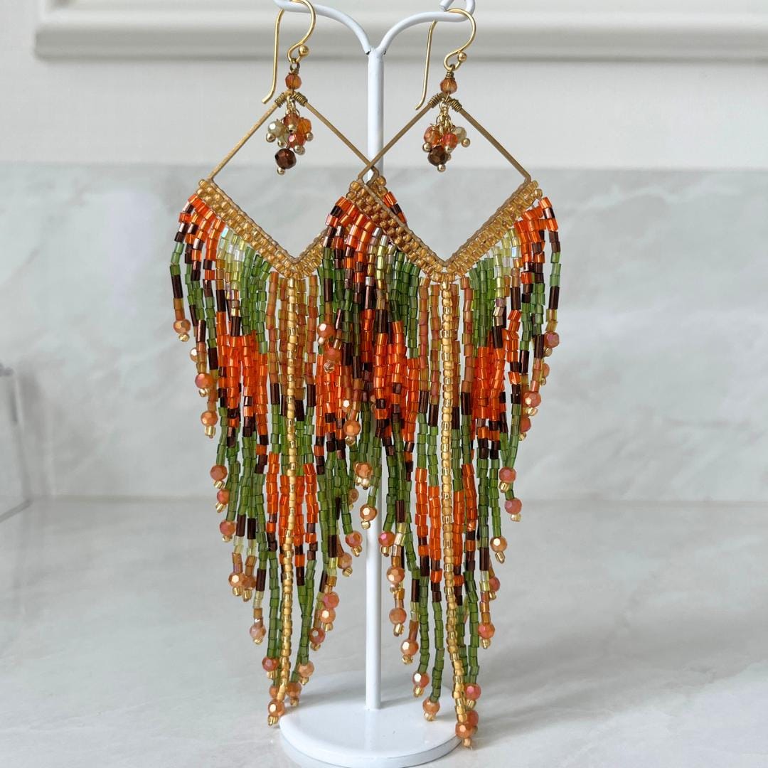 Luxury boho statement earrings handmade with Japanese Miyuki seed beads in warm autumn colours and gold details.