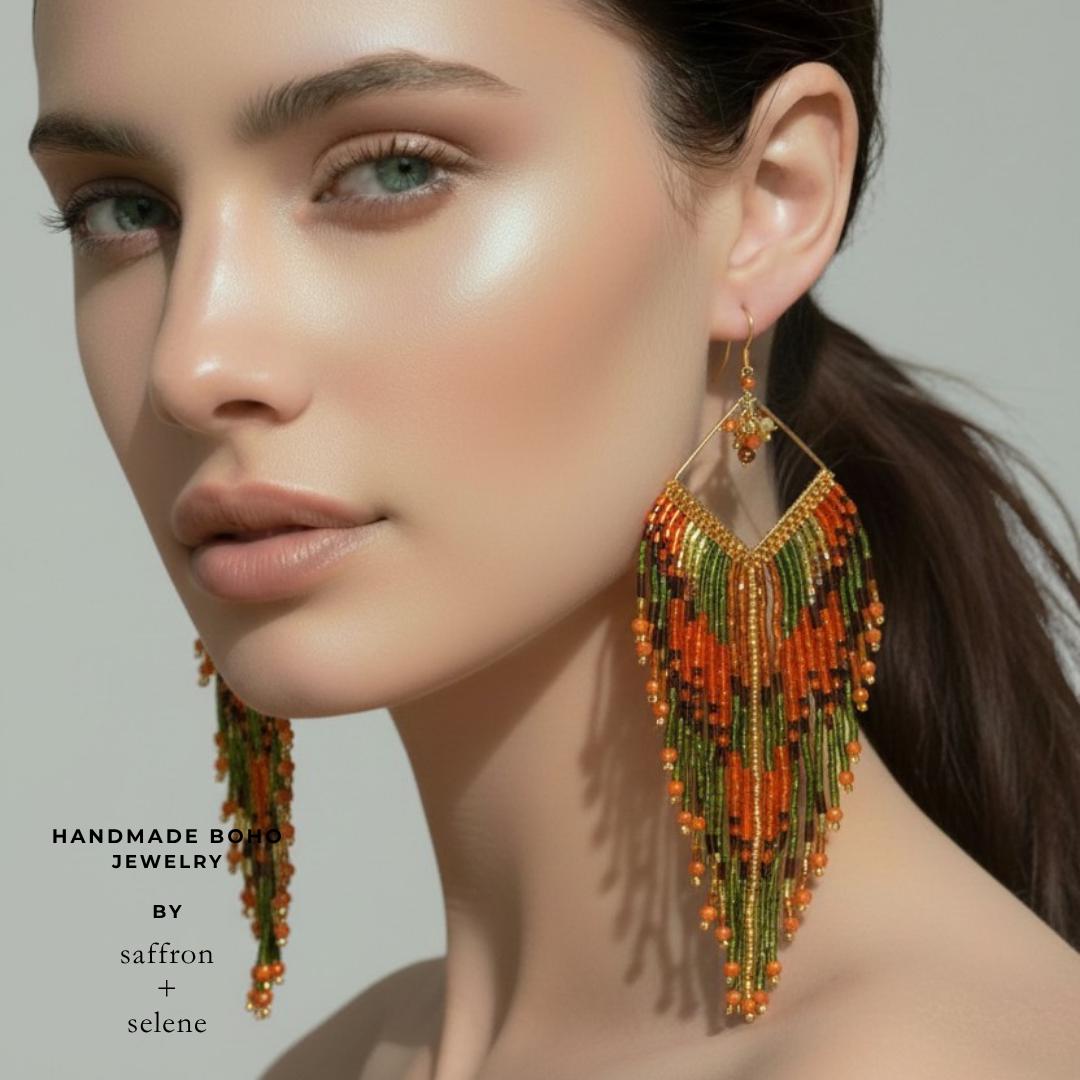 Long beaded fringe earrings in burnt orange, olive green and bronze with shimmering iridescent crystal accents.
