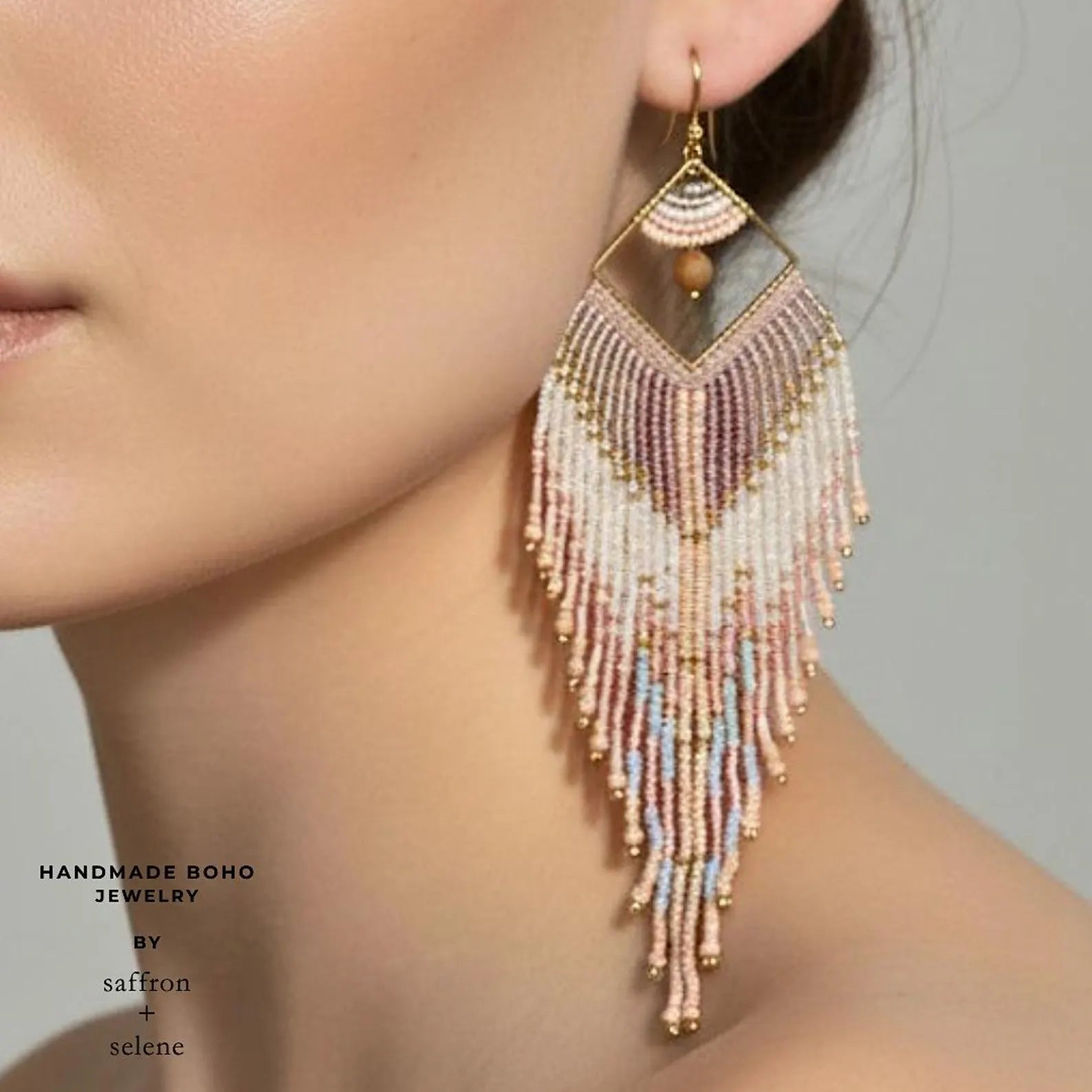 Pink seed bead earrings in long aztec feather design, created by Saffron and Selene Boho Jewelry